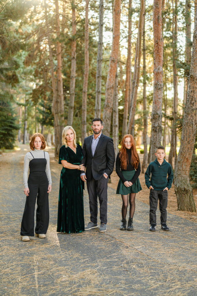 Utah family photography winter family photo outfits for Christmas Tree Family mini sessions taken by a utah family photographer in a forest in Alpine, UT.
