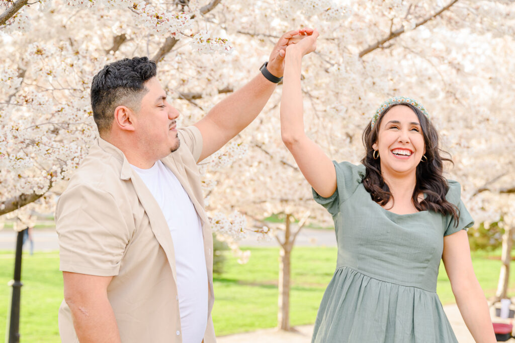 couple dancing Utah state capitol blossoms spring family photos by a utah family photographer 