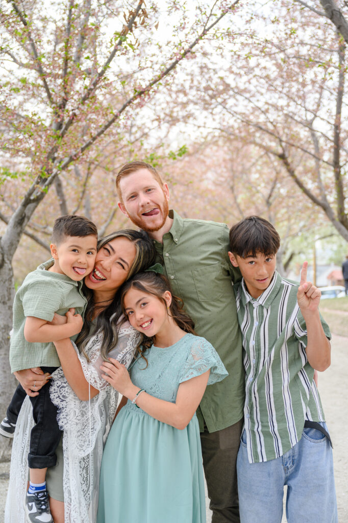 • Utah spring family portraits surrounded by cherry blossoms at State Capitol