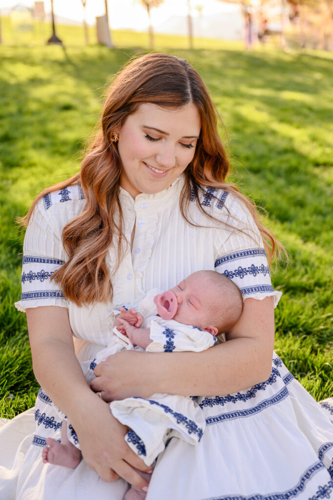 • Mother and daughter walking through blooming cherry trees at Utah Capitol