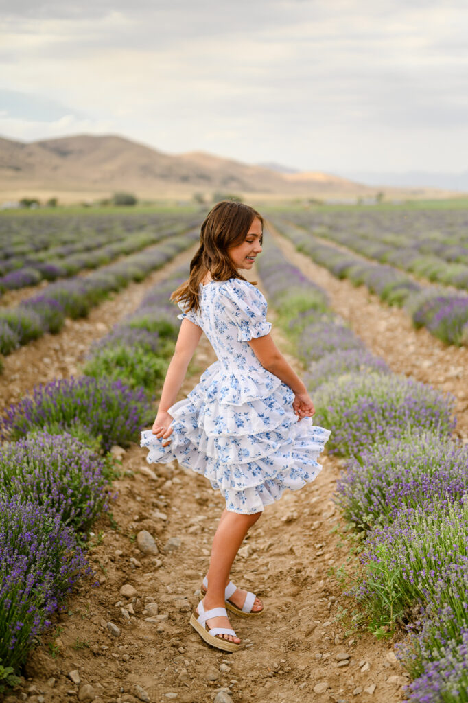 Family posing in the lavender field for family pictures taken by the best family photographer in utah