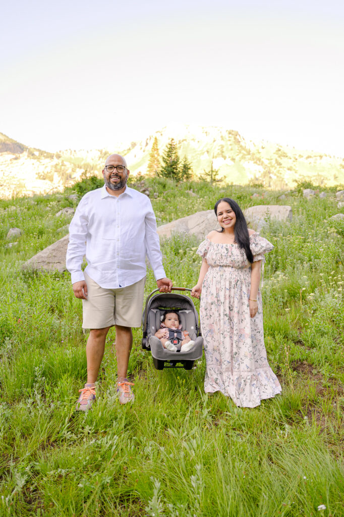 photo of a family in the wildflowers up little cottonwood canyon for family pictures taken by luxury utah family photographer