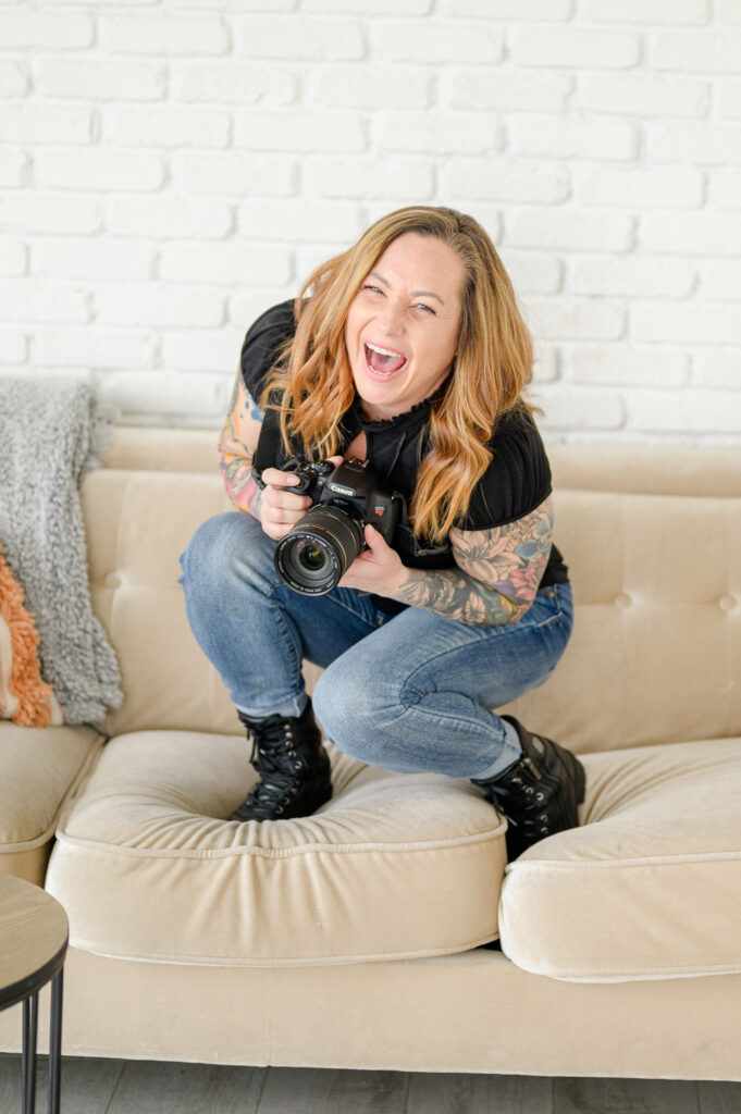 photographer on a couch for brand photoshoot in studio utah brand photographer