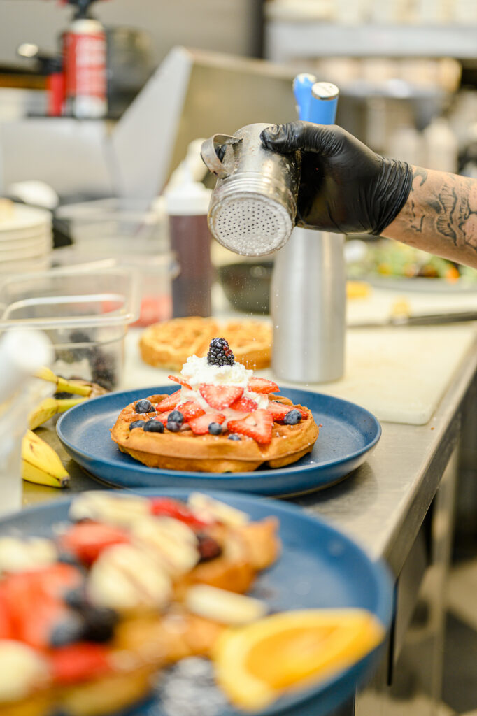 Restaurant kitchen preparing dishes for professional food photoshoot