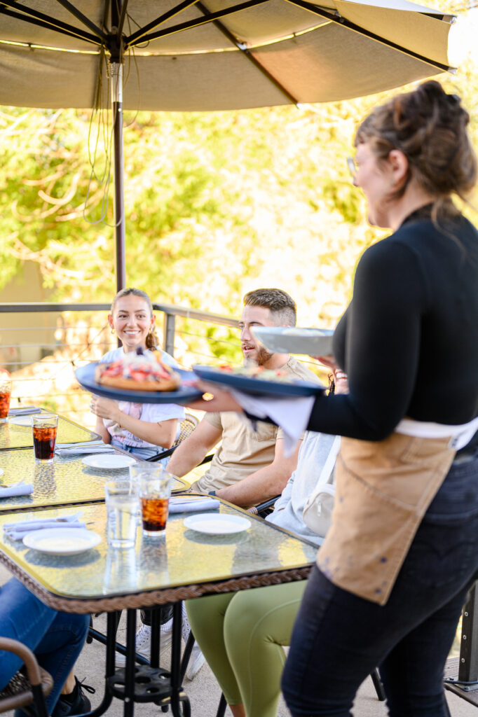 Restaurant staff collaborating during marketing photoshoot
