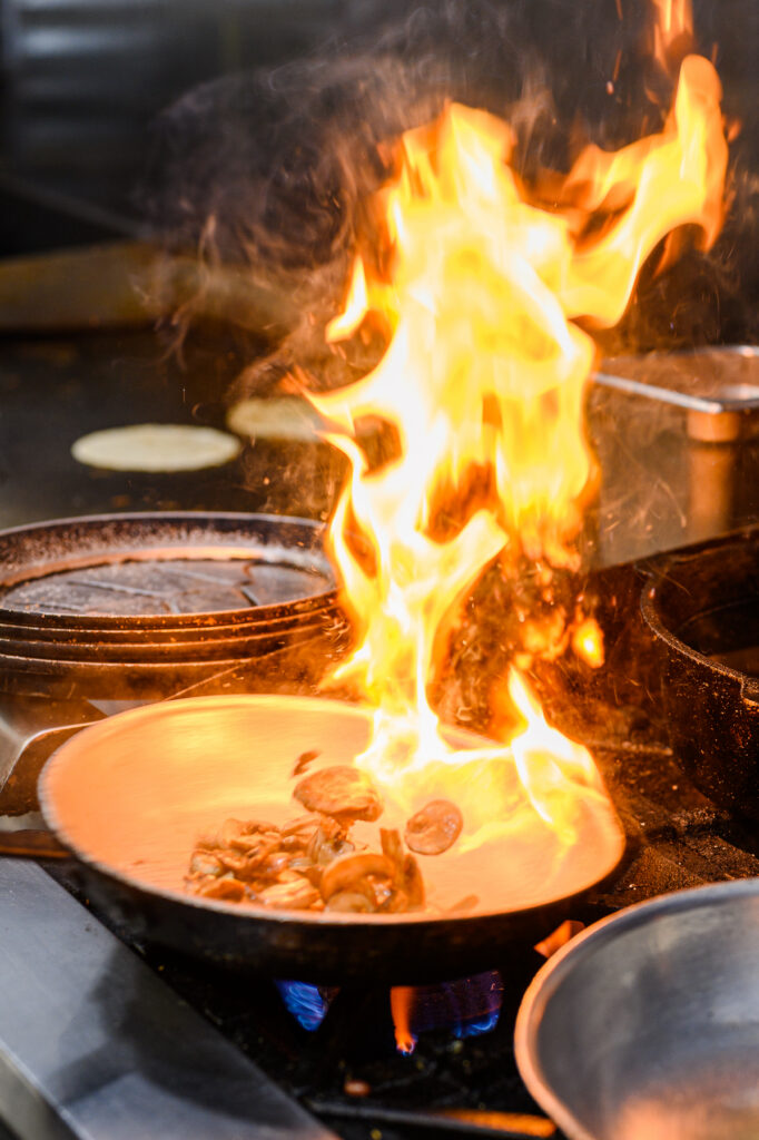 Food photographer arranging ingredients for commercial restaurant photography