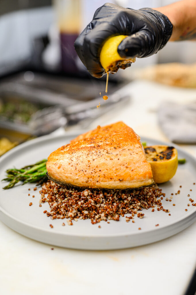 Restaurant chef plating dish during professional food photography session