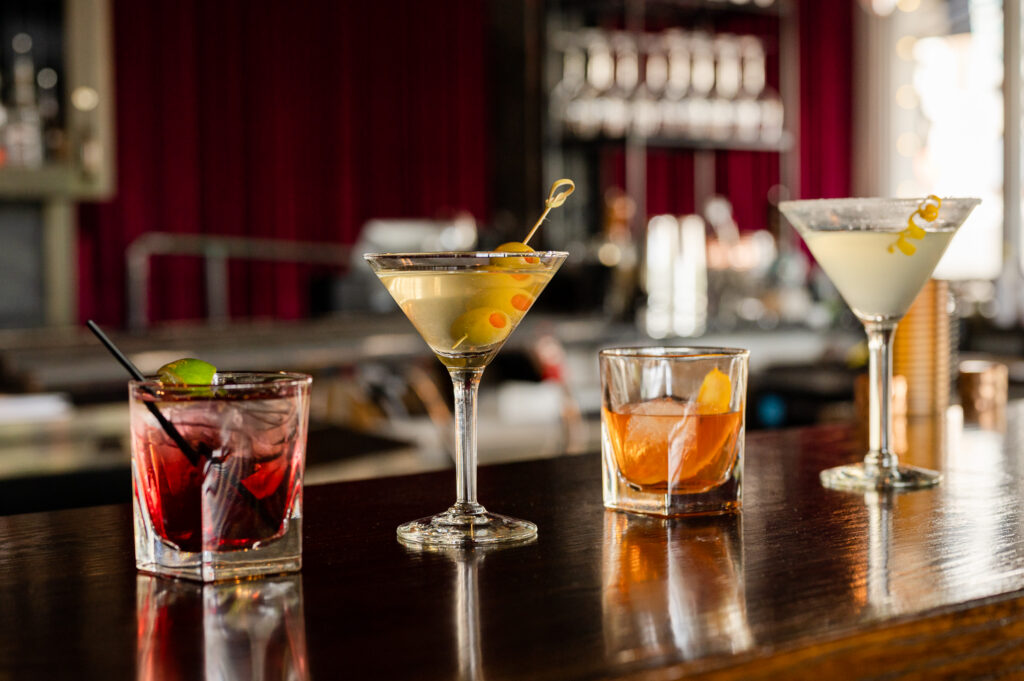 Bar staff preparing signature cocktails for marketing photos